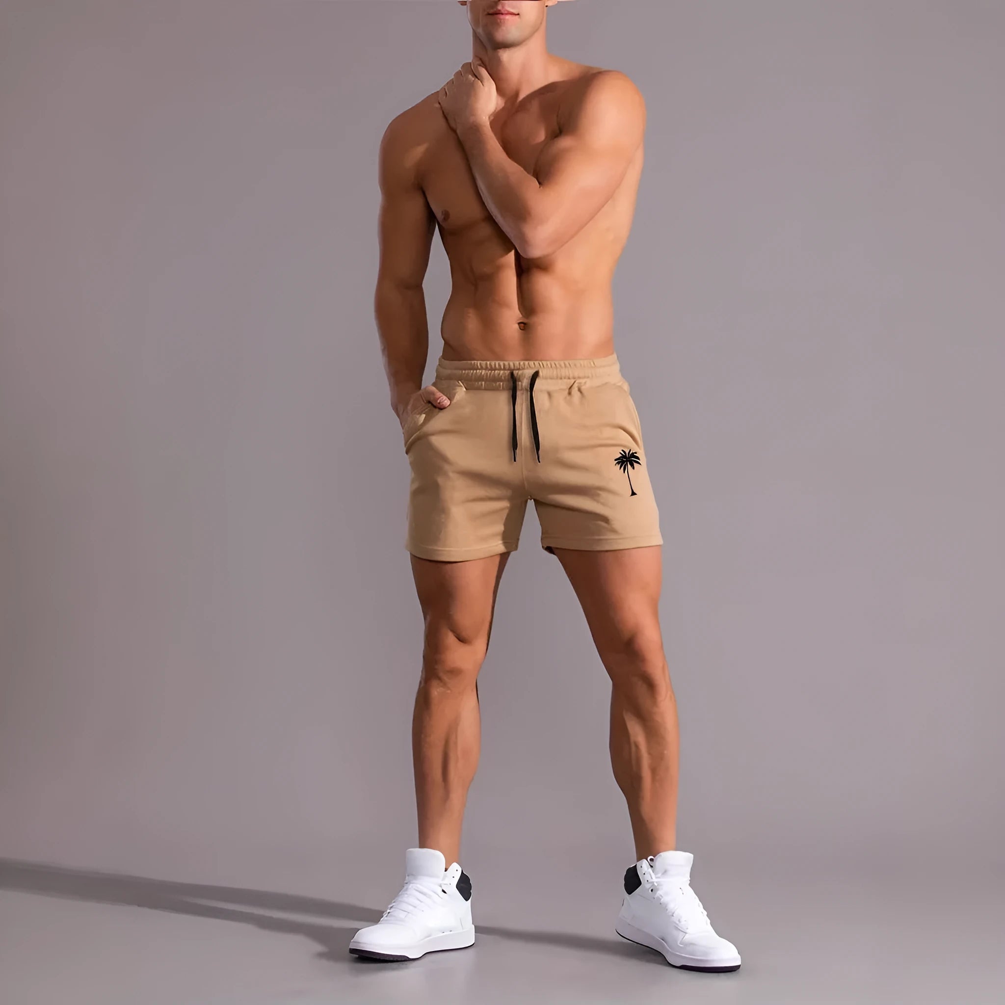 Men's khaki sports shorts with coconut print pattern showing straight cut and micro-elastic polyester fabric