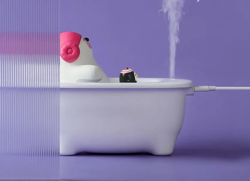 White USB-powered air humidifier with large water tank on a desk