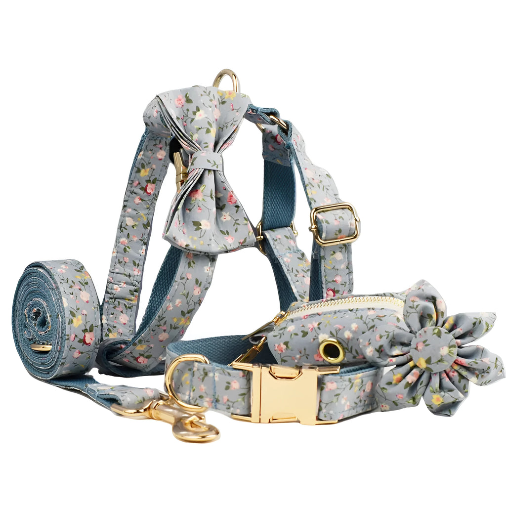 Blue floral polyester cotton dog collar and matching leash set with bow, vest, and poop bag accessories