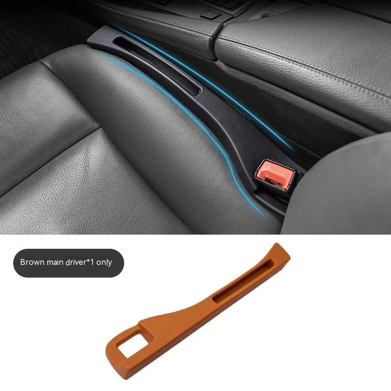 Black car gap storage box with handle positioned between car seats