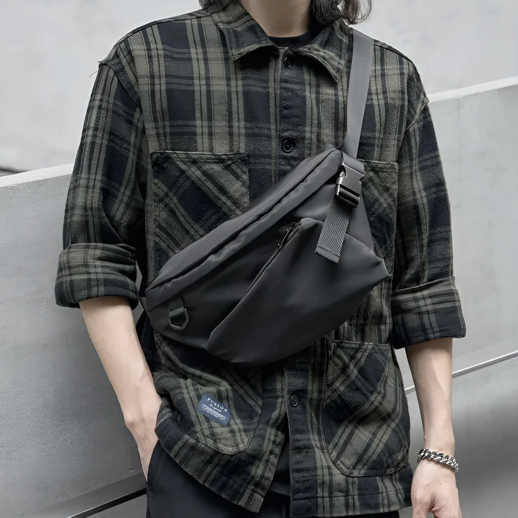Black men's slanted chest bag made from Oxford fabric with 8-inch capacity and sewing line details