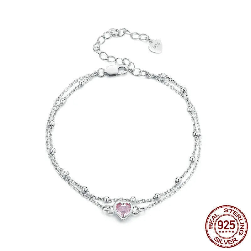 Sweet girlish style 925 sterling silver bracelet with a small heart-shaped charm on an adjustable chain.