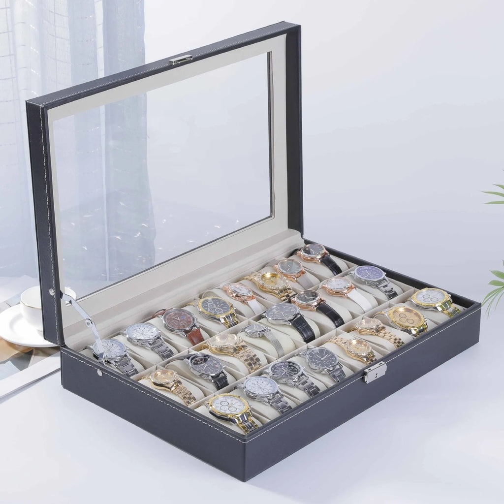 Grey leather watch storage box with transparent lid showing multiple watch slots inside