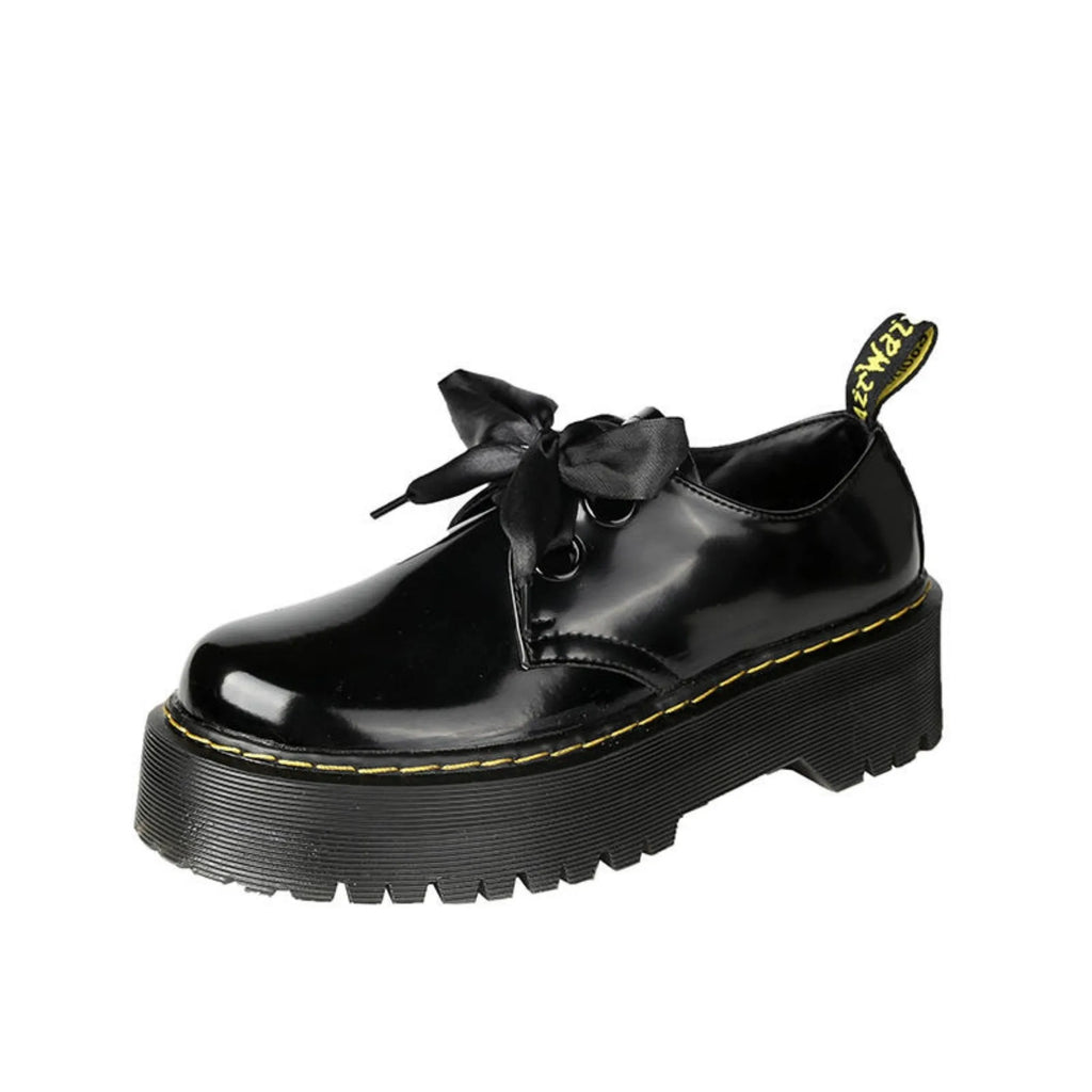 Women's white thick-soled lace-up shoes with ribbon and cross-strap details on a superfine fibre upper.