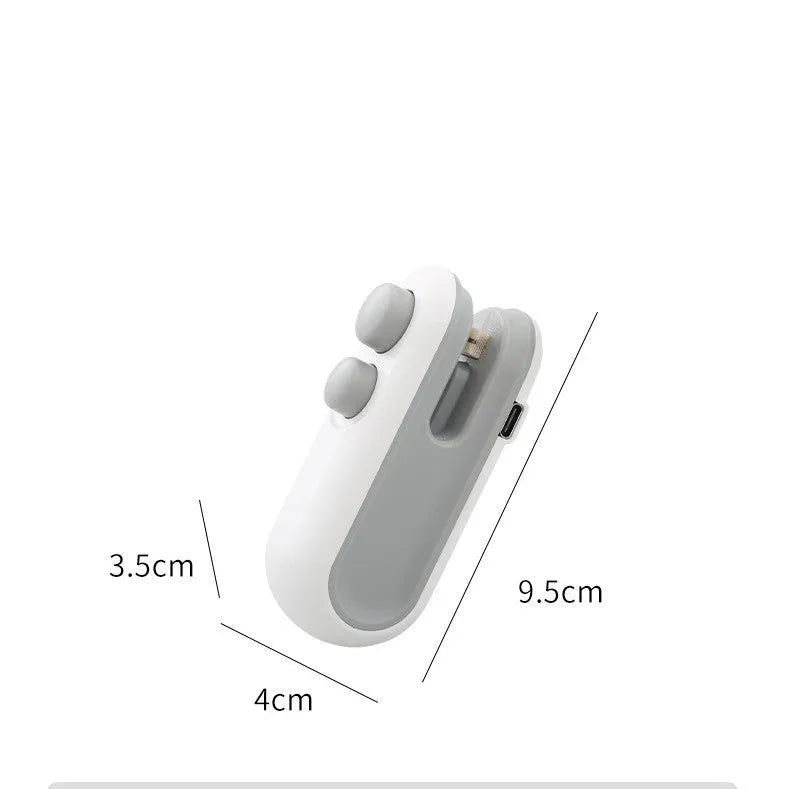 Blue and white handheld USB rechargeable food sealer with magnetic back and cutter blade.
