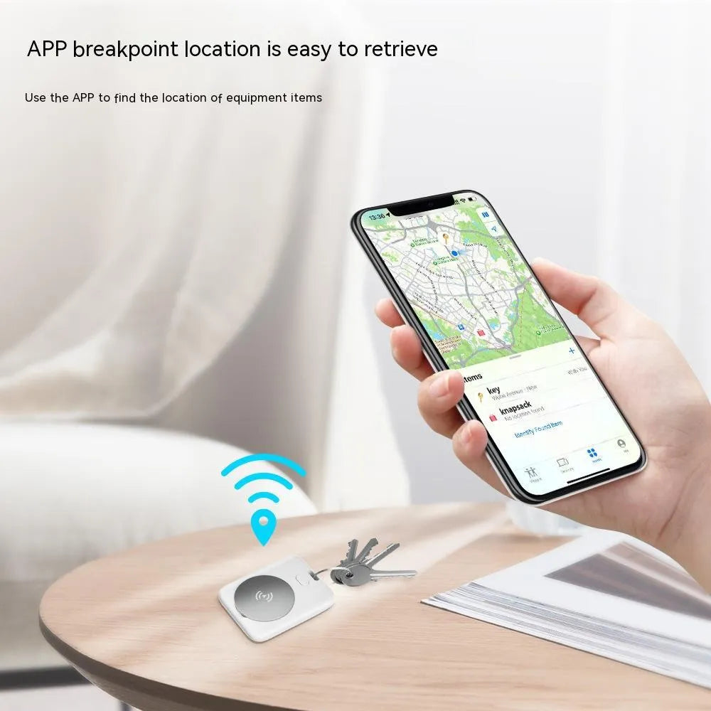 White ABS pet tracking device for Apple users showing lightweight design and portable attachment