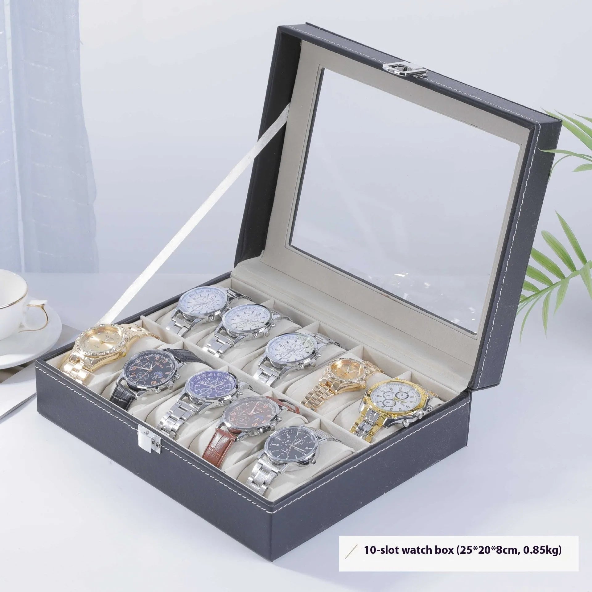 Grey leather watch storage box with transparent lid showing multiple watch slots inside