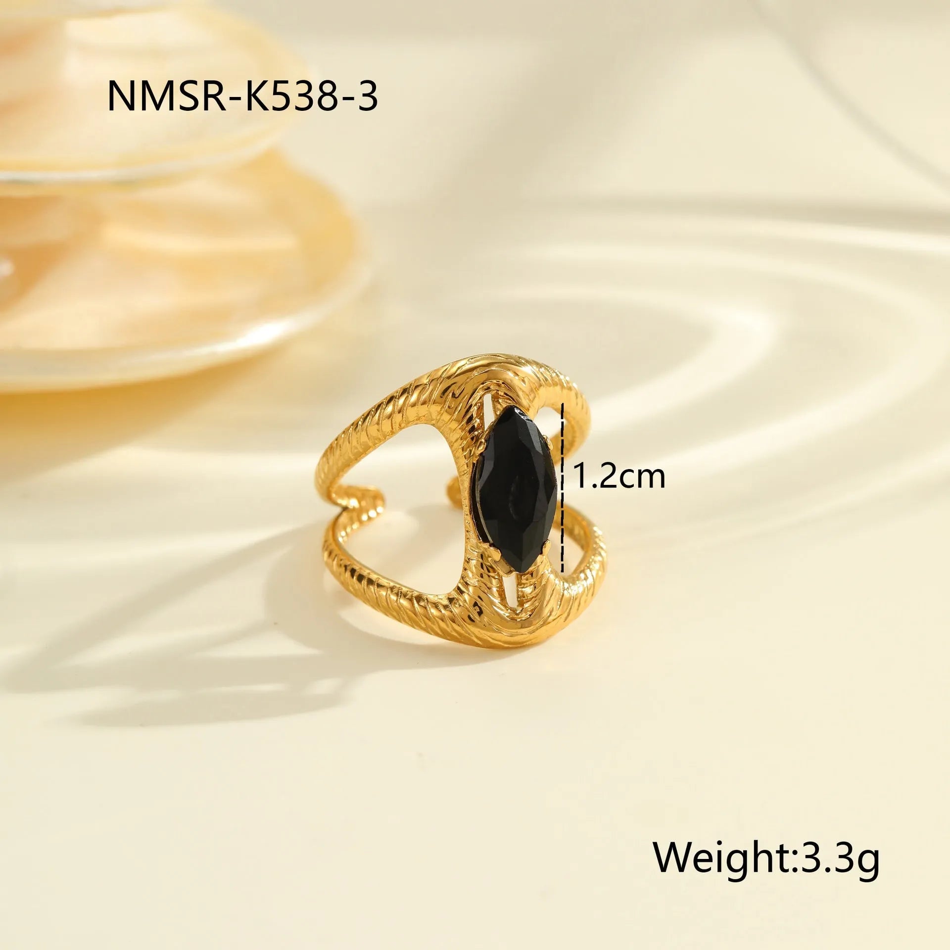Geometric open mouth titanium steel ring for women on a plain background.