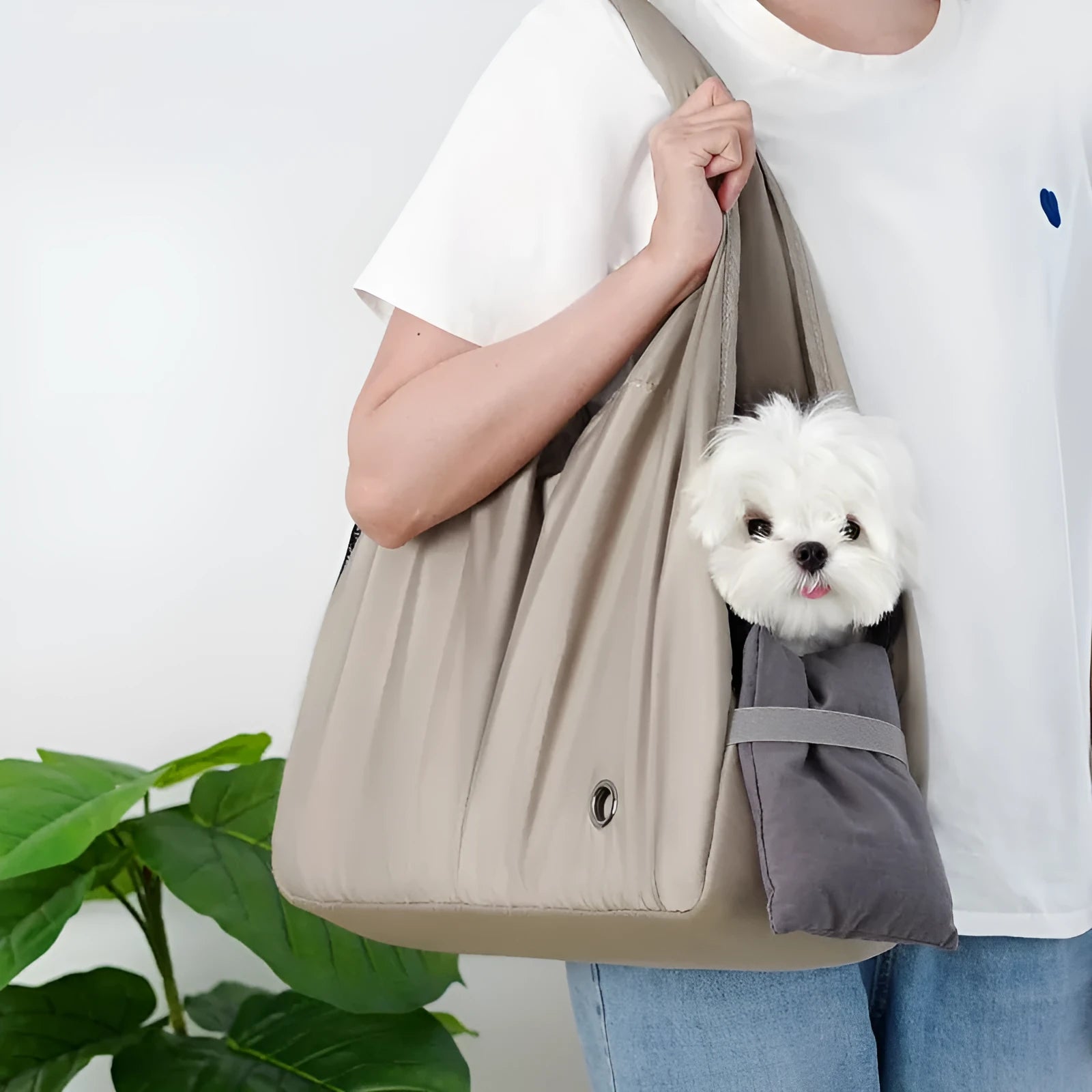 Apricot coloured cloth pet carrier handbag showing breathable fabric and portable design