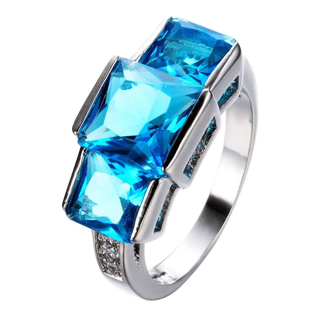 Women's geometric rainbow metal ring in electroplated copper showing colour options.