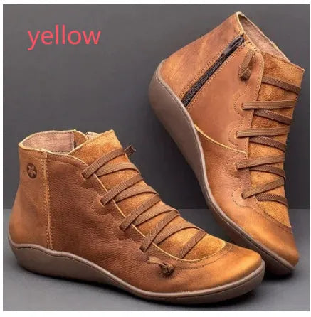 Women's casual flat booties with wedge heel and round toe in artificial PU and rubber.