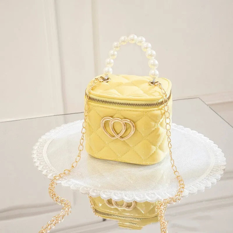 PVC bucket-shaped gel bag with a heart pattern, shown in one of seven available colours.