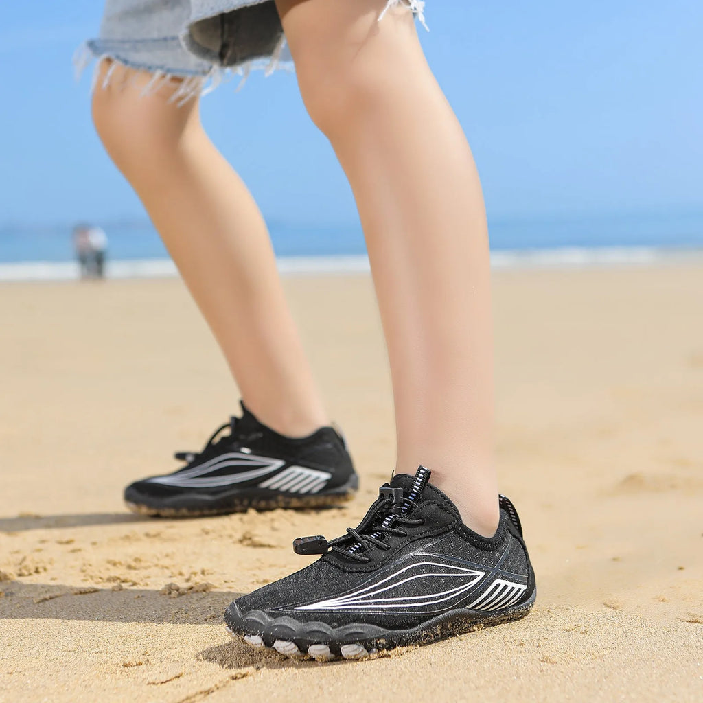 Children's elasticated water shoes in blue with a non-slip rubber sole and breathable mesh upper.