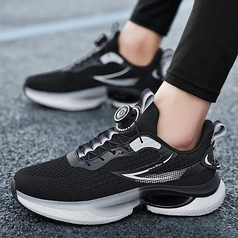 Men's low-top running shoes with rotating button buckle on beige Fly-kit mesh upper and TPU sole.