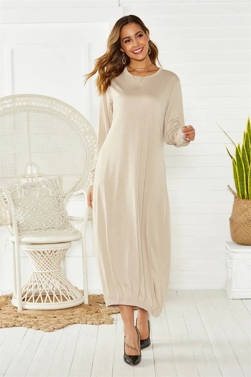Black loose lantern dress with lace-up crew neck and long sleeves on mannequin