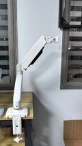 Black and white rotating telescopic LCD monitor stand with metal aluminium construction on a desk