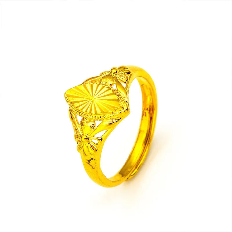 Gold geometric flower ring with textured brass construction and open diamond design