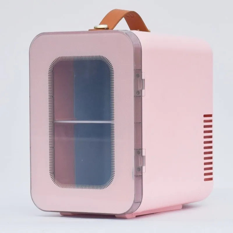 Pink mini refrigerator with transparent door showing internal storage compartments