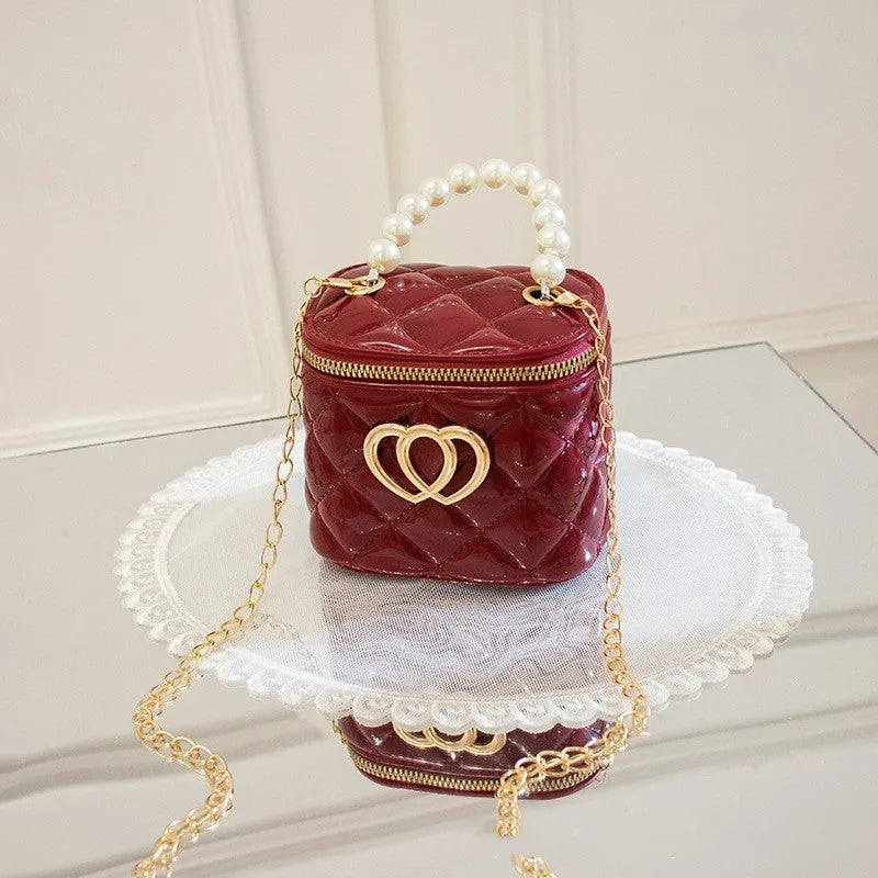 PVC bucket-shaped gel bag with a heart pattern, shown in one of seven available colours.