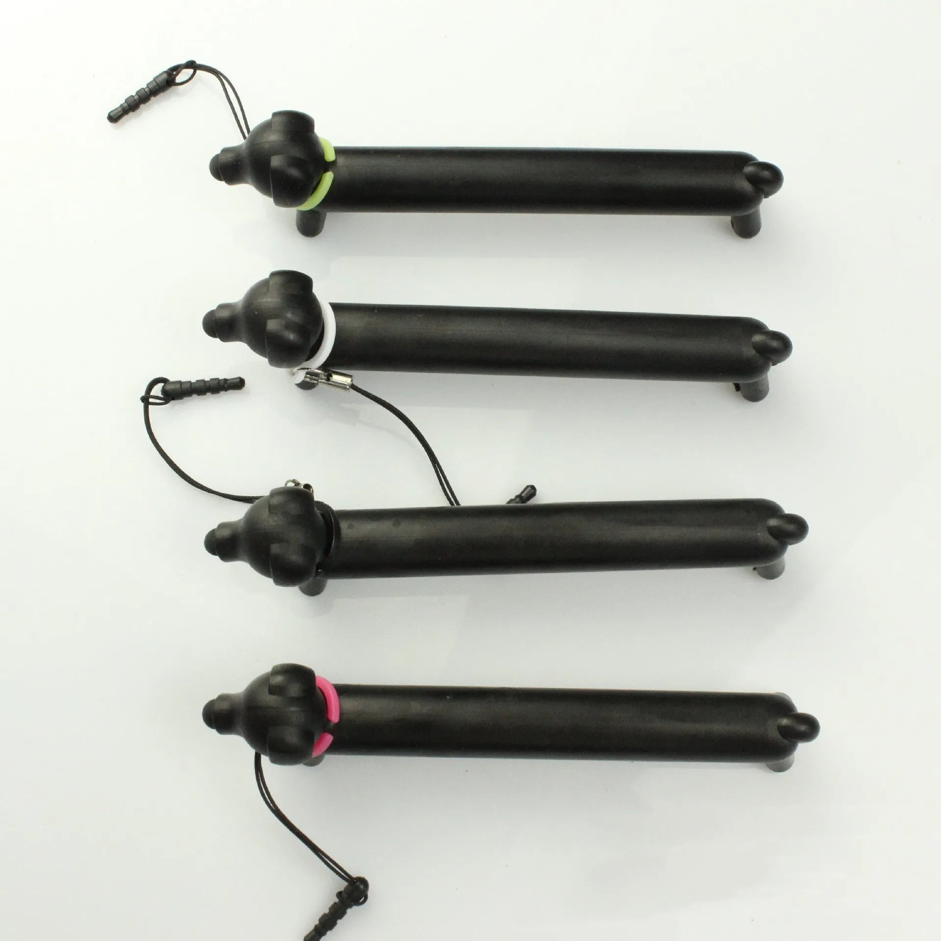 Black dog-shaped touch screen stylus pen showing adjustable length design and phone holder functionality