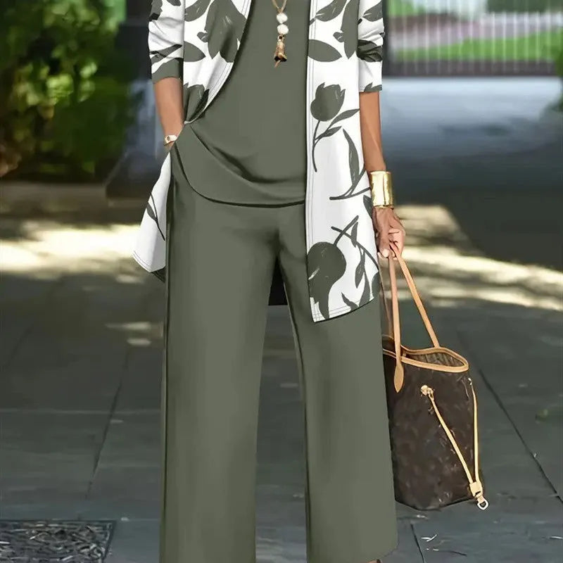Women's blue three-piece casual suit featuring a long-sleeve coat, a vest, and full-length trousers.