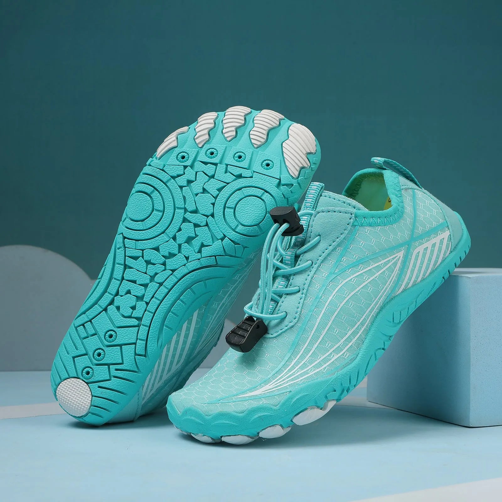 Children's elasticated water shoes in blue with a non-slip rubber sole and breathable mesh upper.