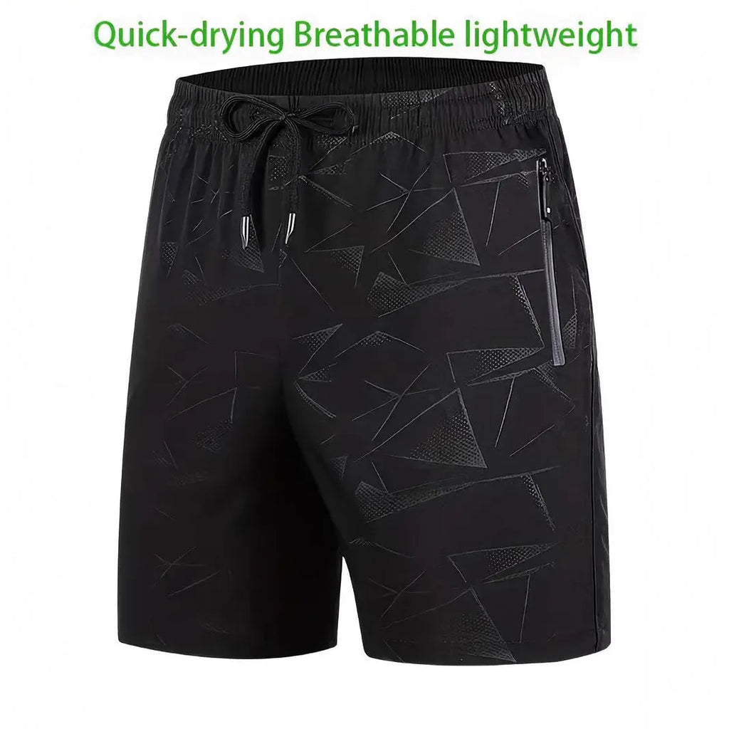 Man wearing loose grey polyester sports shorts with an elastic waistband.