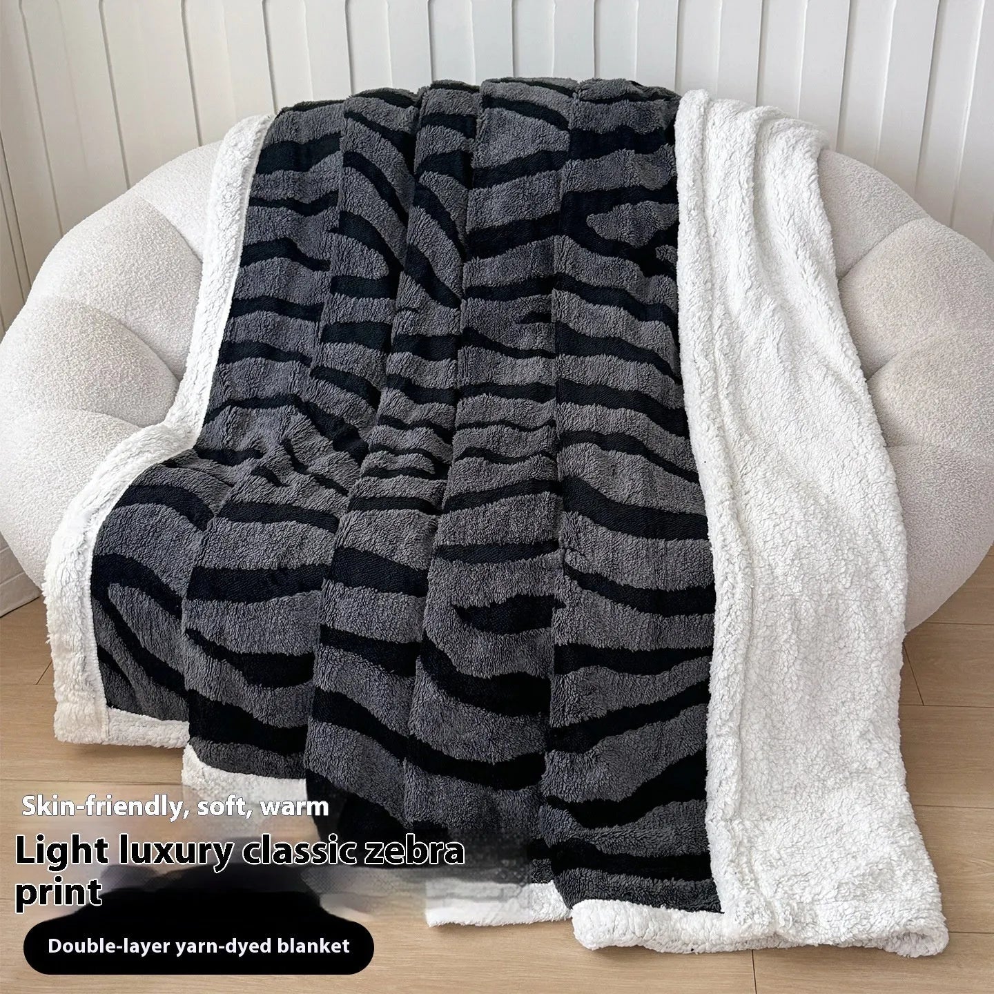 Double-layer Jacquard taffeta blanket with leopard print design in camel colour folded to show texture and pattern detail