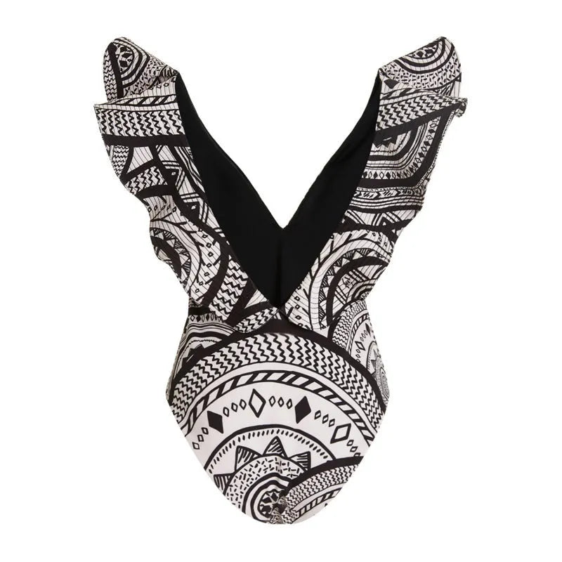 Vintage printed deep V-neck one-piece swimsuit for women with ruffle trim and matching wrap skirt.