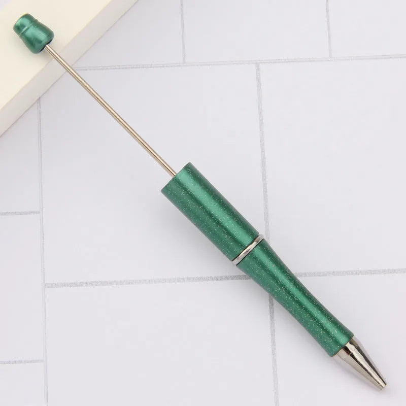 Creative ballpoint pen with multicoloured spinning plastic beads on a steel wire frame.