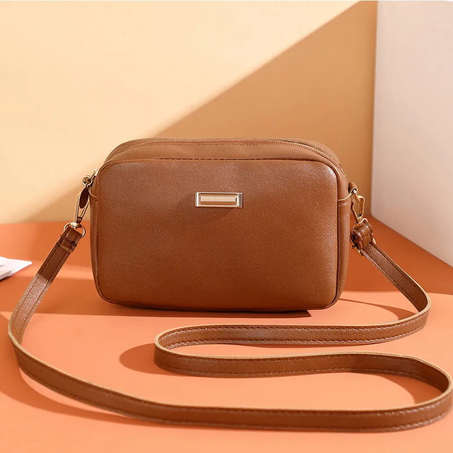 Women's solid colour PU shoulder bag with three-dimensional pockets in horizontal square shape