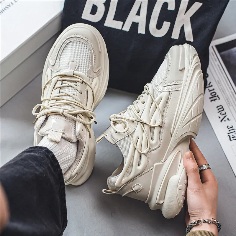 Men's low-top sneaker in beige with breathable mesh upper and rubber sole, lace-up design.